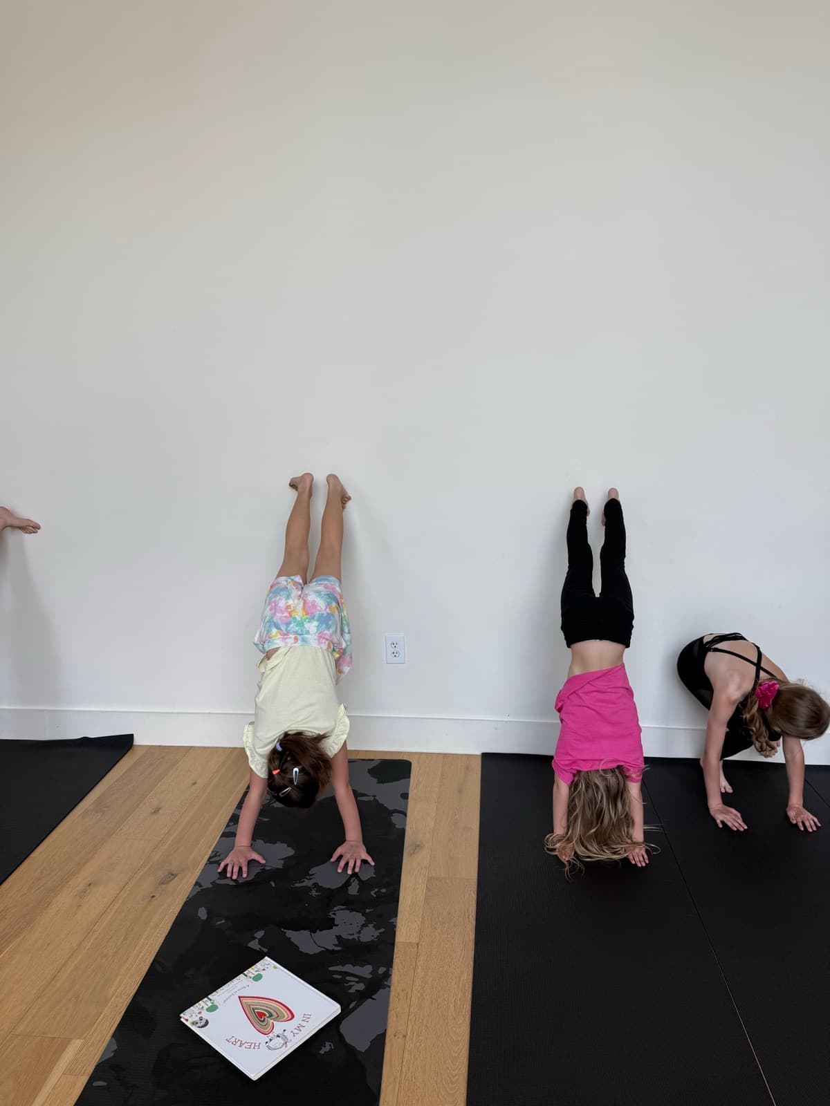 Children participating in a Houston Kids Yoga group session