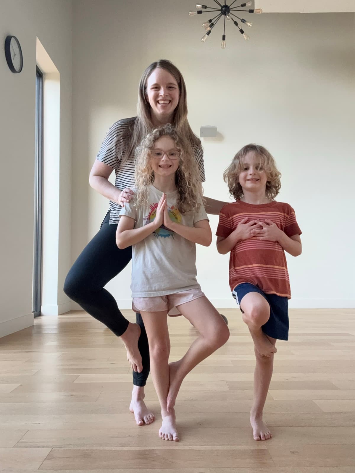 Meredith with children during a yoga activity